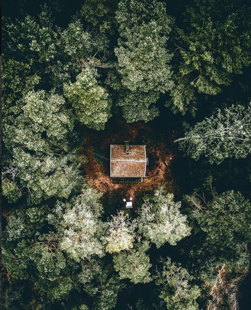 Cabin in the forest from above, photo by Tobias Hägg