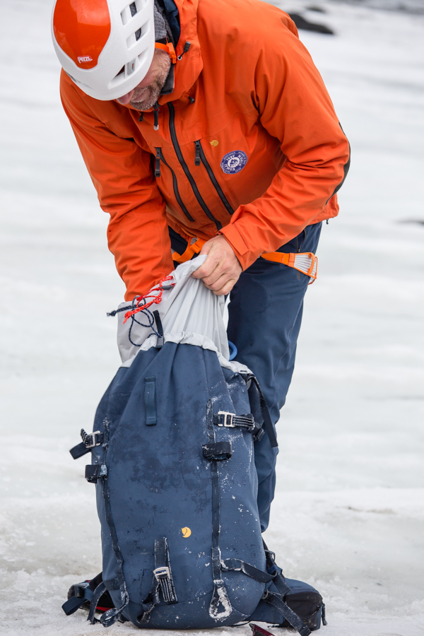 Magnus Lindnor Strand packing his backpack 